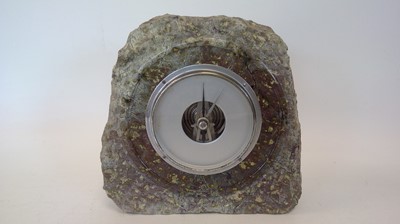Lot 11 - A Serpentine barometer, height 20cm.