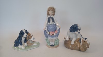 Lot 68 - Three NAO figures, two of dogs and one of girl...