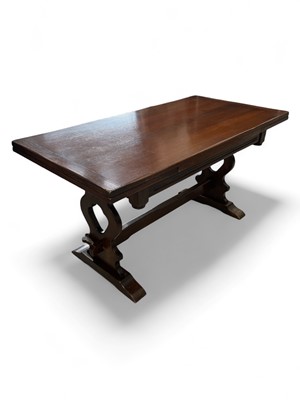 Lot 82 - An oak refectory draw-leaf dining table 76cm...