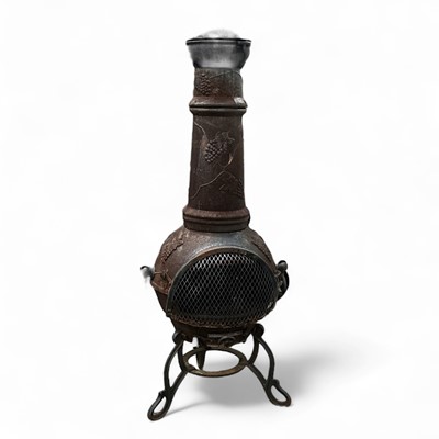 Lot 81 - A good quality, cast iron chiminea with a vine...