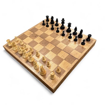 Lot 107 - A folding wooden chess board together with a...
