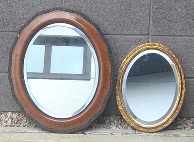 Lot 160 - A wood-framed Bevelled edged oval mirror 65 x...