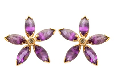 Lot 12 - A pair of Victorian 9ct rose gold amethyst and diamond set flower head earrings.