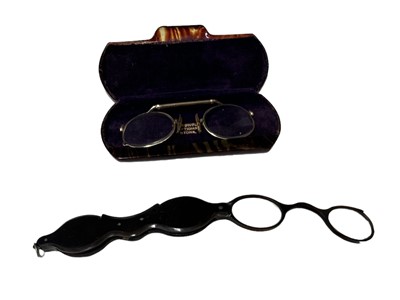 Lot 204 - Tortoise shell lorgnette glasses and a pair of...