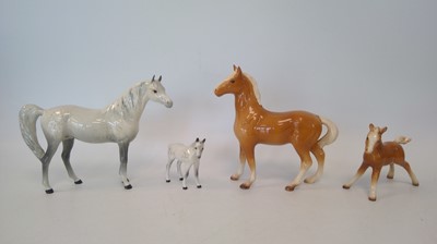 Lot 244 - A Beswick white horse and foal, with a...