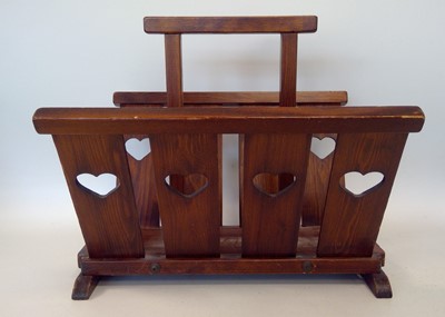 Lot 270 - A wooden magazine rack with heart cut-outs,...