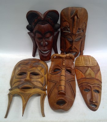 Lot 274 - Five Hardwood African Tribal Masks. The...