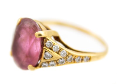 Lot 22 - An 18ct hallmarked gold pink Tourmaline and diamond set dress ring.