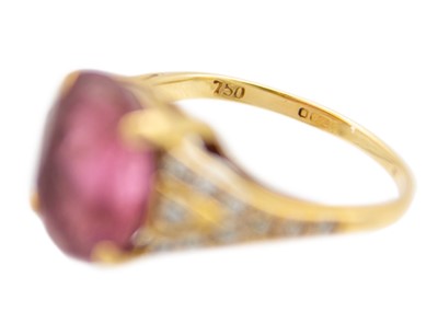 Lot 22 - An 18ct hallmarked gold pink Tourmaline and diamond set dress ring.