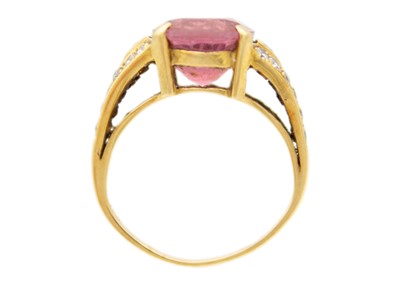 Lot 22 - An 18ct hallmarked gold pink Tourmaline and diamond set dress ring.