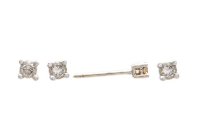 Lot 66 - Four white gold diamond solitaire set stud earrings.