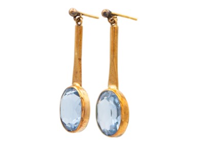 Lot 24 - A pair of early 20th century 9ct rose gold blue spinel set drop earrings.