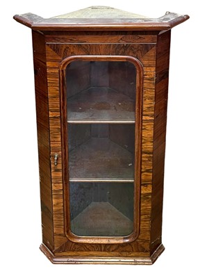 Lot 697 - A Victorian glazed rosewood hanging corner cupboard.