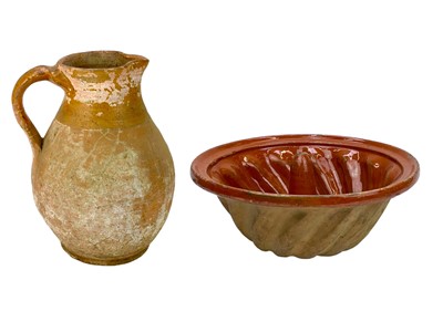 Lot 620 - A pottery jug.