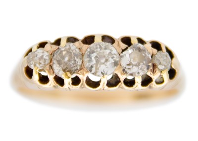 Lot 82 - A Victorian 18ct old mine cut diamond set five stone ring.
