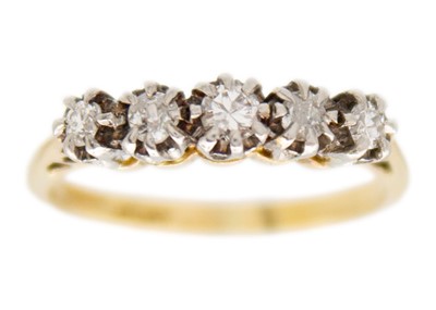 Lot 62 - An 18ct and platinum diamond set five stone ring.
