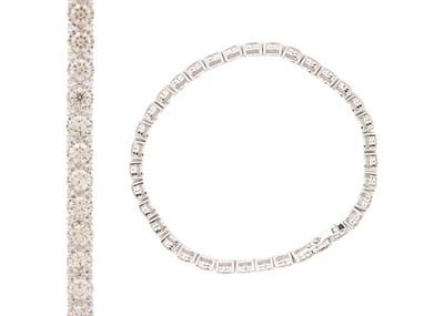 Lot 84 - An impressive 9ct white gold, 11.3ct diamond set line bracelet.