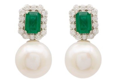 Lot 145 - A pair of 18ct white gold emerald diamond and white cultured pearl earrings.