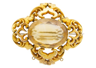 Lot 83 - A Victorian high-purity gold (tests 14ct) oval cut citrine set brooch.