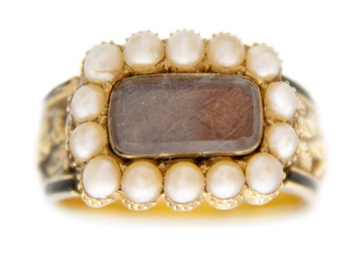 Lot 93 - A George IV 18ct hallmarked gold and black enamel seed pearl set memorial ring.