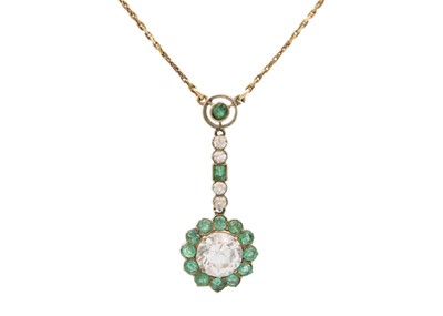 Lot 95 - A rose gold emerald and synthetic white sapphire set pendant necklace.