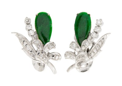 Lot 194 - A pair of white gold diamond and green jade set screw back earrings.