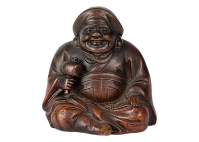 Lot 557 - A Japanese bizen pottery figure of Daikoku, late 19th/early 20th century.