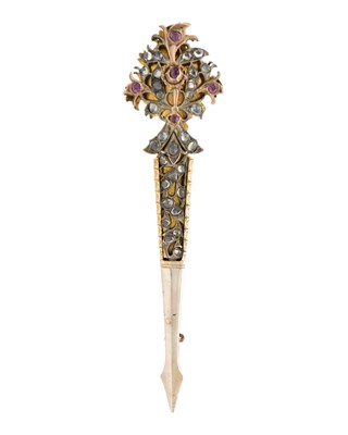Lot 163 - An Indian gilt metal turban pin.