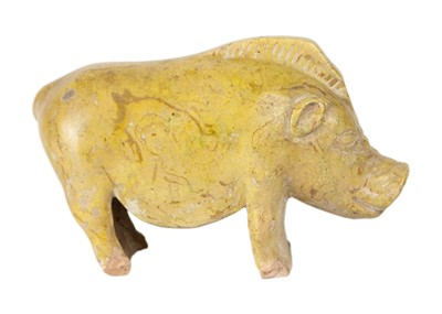 Lot 309 - A Chinese Han style pottery glazed model of a pig.