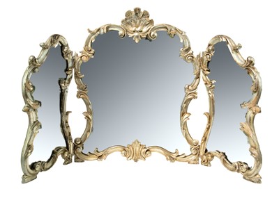 Lot 580 - A rococo style silvered triptych dressing table mirror.