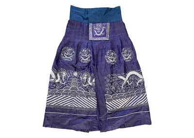 Lot 296 - A Chinese metal thread decorated cotton and silk skirt, late Qing Dynasty.