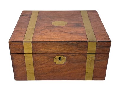 Lot 63 - A 19th century walnut and brass bound writing box.