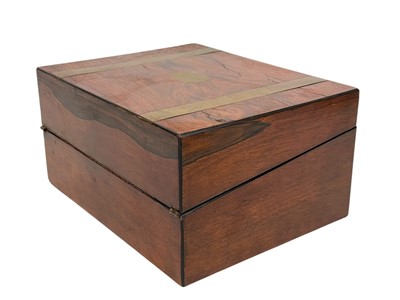 Lot 63 - A 19th century walnut and brass bound writing box.