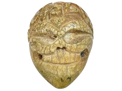 Lot 136 - An unusual carved bone skull.