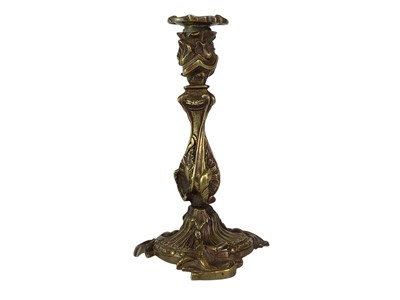 Lot 18 - A pair of French rococo style bronze candlesticks.
