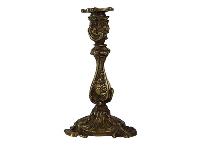 Lot 18 - A pair of French rococo style bronze candlesticks.
