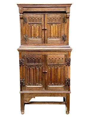 Lot 643 - A small linen fold oak cupboard.