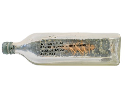 Lot 6 - Model ship in a bottle, 1944