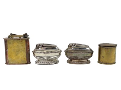 Lot 83 - An early 20th century brass and copper cigarette lighter.
