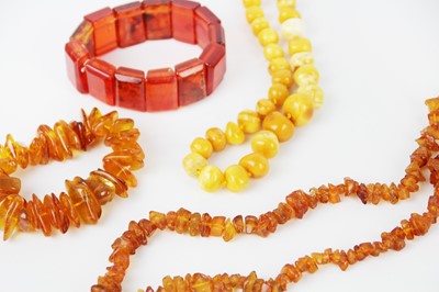 Lot 308 - Two amber bead necklaces and two amber bracelets.