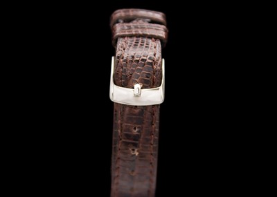 Lot 44 - MOVADO FOR TIFFANY & CO. - A 14ct cased mid-sized gentleman's manual wind wristwatch.