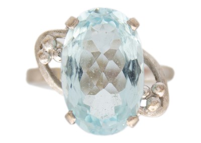 Lot 185 - A platinum aquamarine set dress ring.