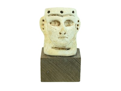 Lot 1053 - A middle Assyrian faience frit mask.