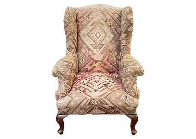 Lot 689 - A mahogany framed wingback armchair.