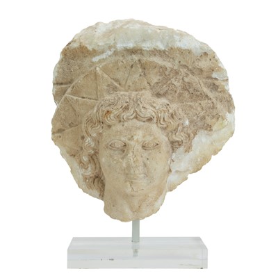 Lot 1112 - A Roman marble head of Helios.