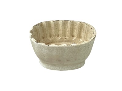 Lot 7 - A collection of eight various pottery jelly moulds.