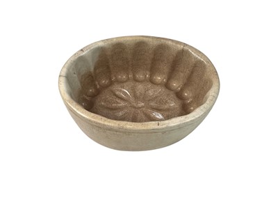 Lot 7 - A collection of eight various pottery jelly moulds.