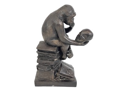Lot 11 - A resin model of Darwin's ape.