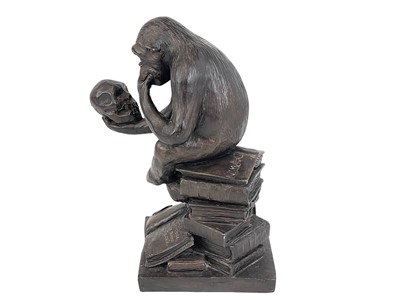 Lot 11 - A resin model of Darwin's ape.