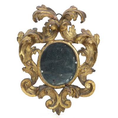 Lot 1016 - A Florentine small carved giltwood wall mirror.
